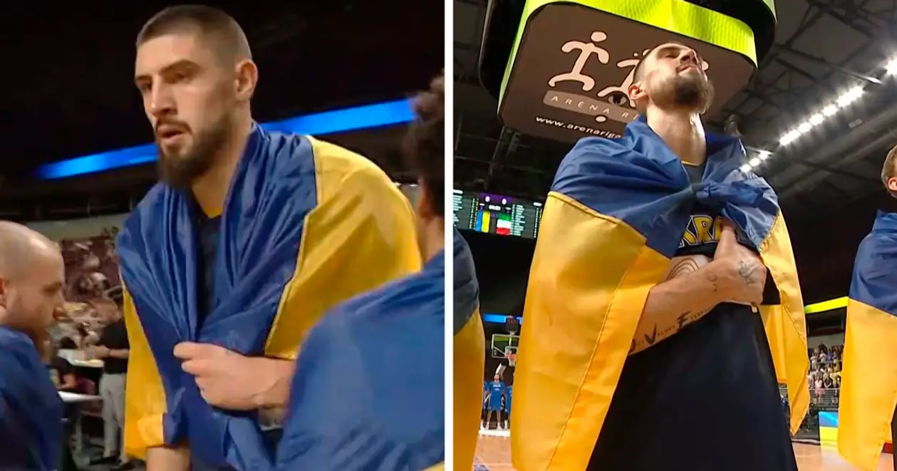 Головне фото баскетбольного дня: тризуб на руці Леня, окутаний синьо-жовтим прапором під час гімну України